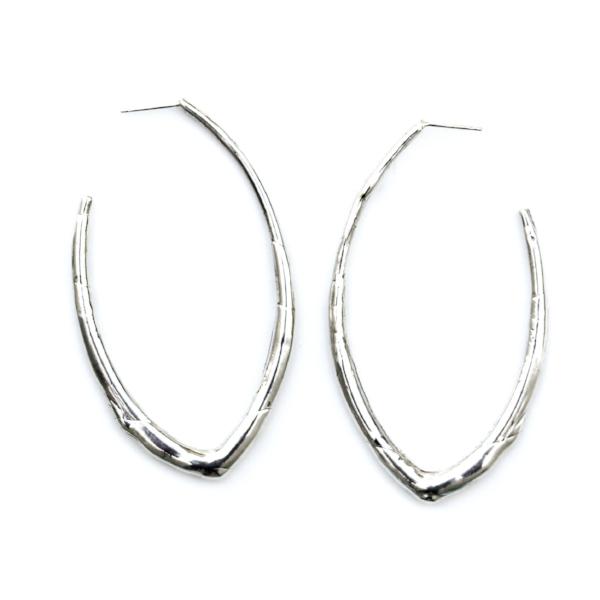 Sterling silver elongated hoop earring featuring an organic texture resembling a smooth twig or vine.