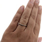 Full view of Karinna Arched MicroPave Band on woman's hand to help give an idea of its scale.