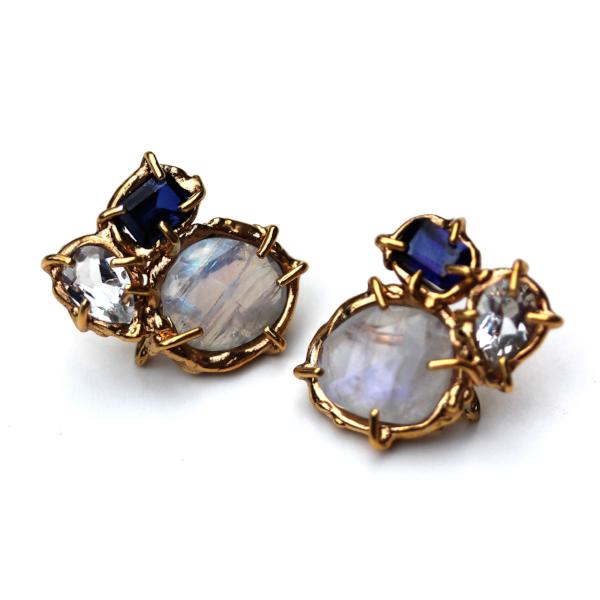 Stud earrings with lab sapphire, moonstone and white topaz, clustered together in an organic 14K yellow gold setting.