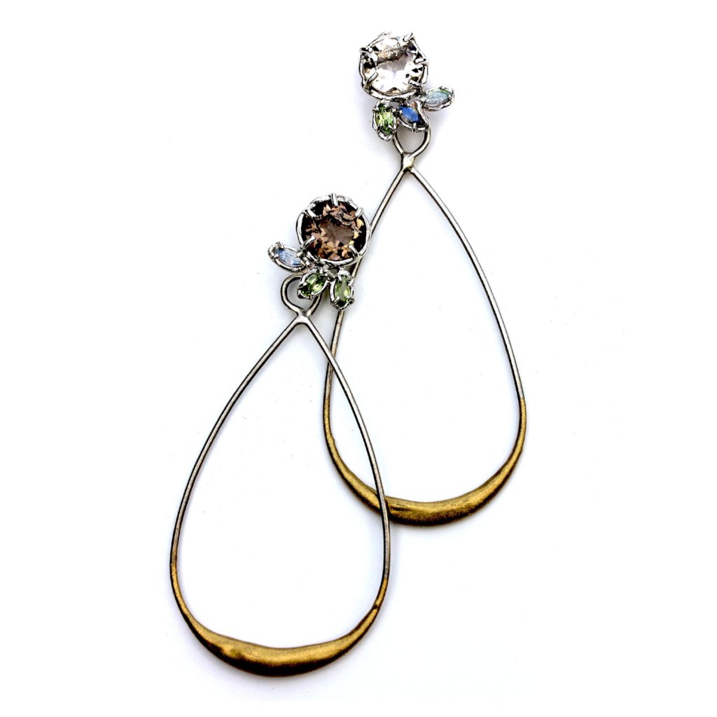 A subtly mismatched pair of earrings in Smoky Quartz, Peridot, Labradorite and Sterling Silver with a Gold Powdercoat accent.