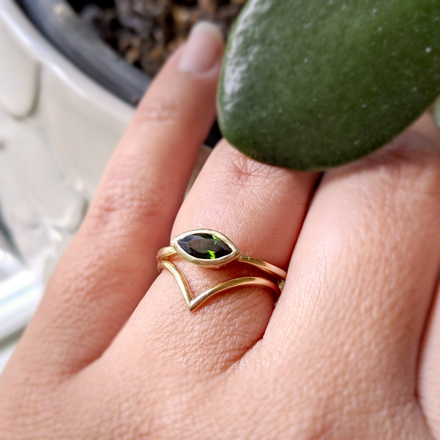 Full view of Olive Ring on woman's hand to help give an idea of its scale.