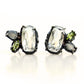 Slightly asymmetric stud earrings with white topaz, peridot and labradorite clustered together in an organic blackened sterling silver setting.