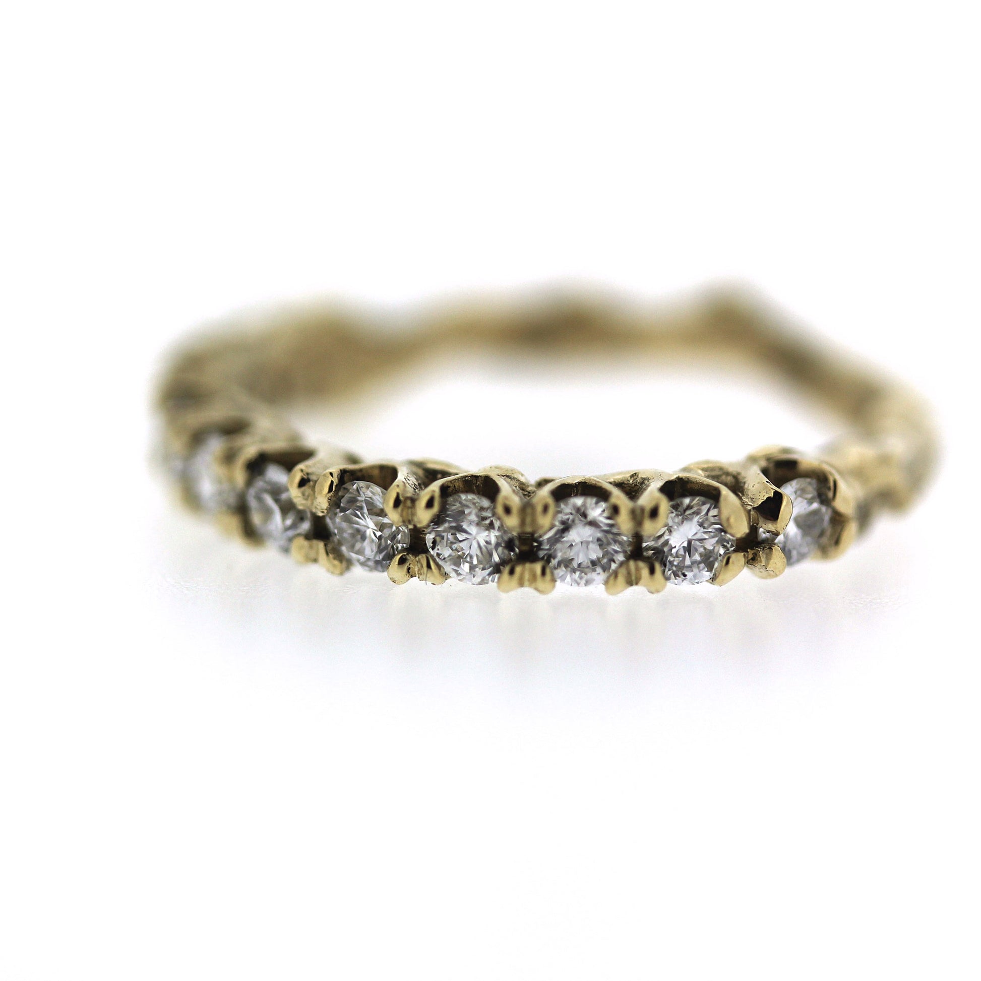 ethically made 2mm diamond engagement half eternity band with unique organic texture and side viewing, detail image of diamonds and prongs