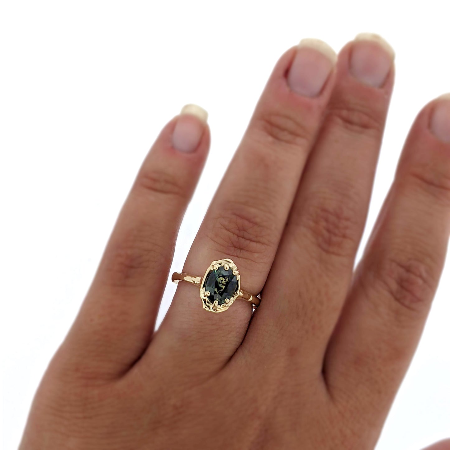 Full view of Rianna Ring on woman's hand to help give an idea of its scale.