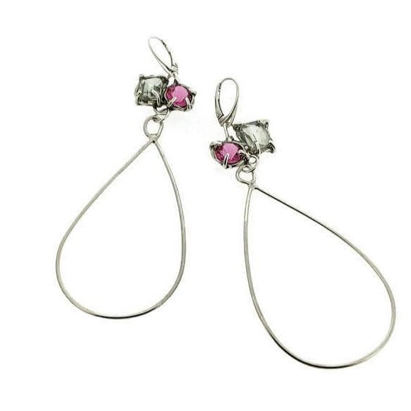 Full view of Parker Earrings. These dangle earrings showcase a cluster of a green amethyst and a pink sapphire set in silver with a long teardrop shaped silver wire hanging from them.