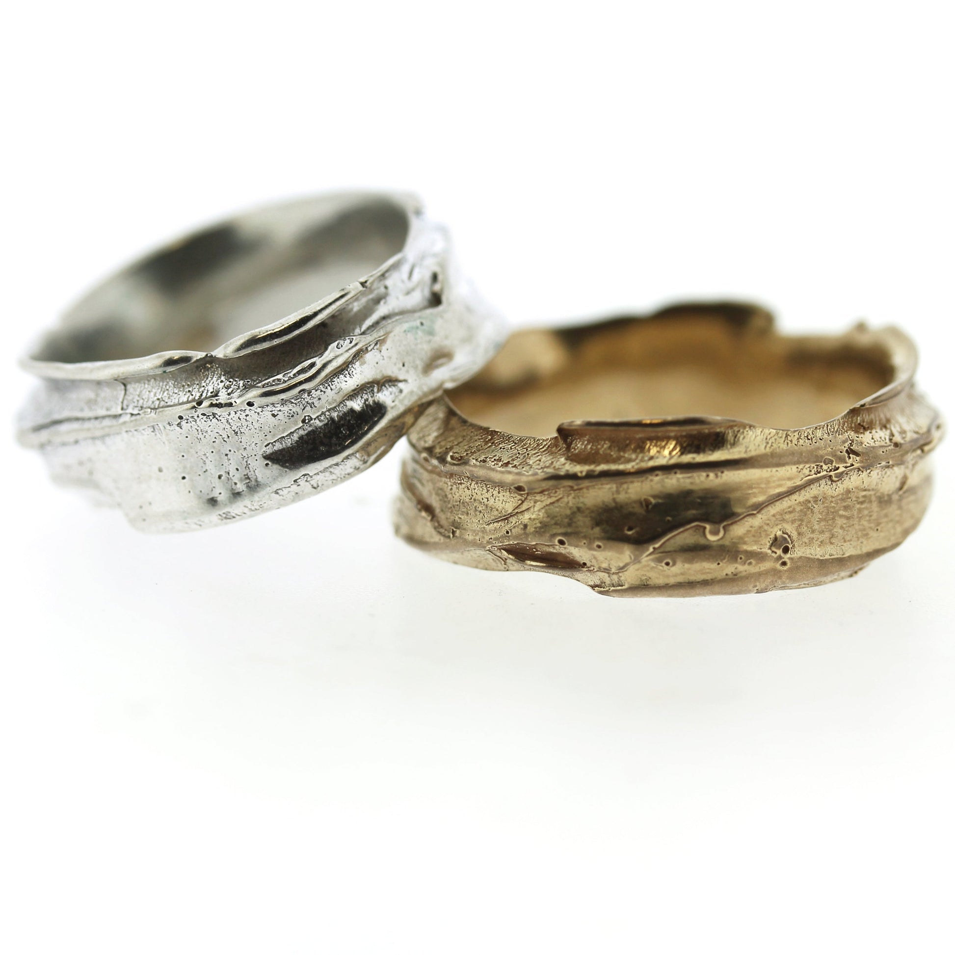 Full view of gold and silver Men's Summit Bands stacked on top of one another.