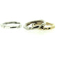 Full view of silver and gold Surge Band stacked on top of one another and white gold band standing off to the side.
