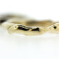 Close up view of gold Surge Band.