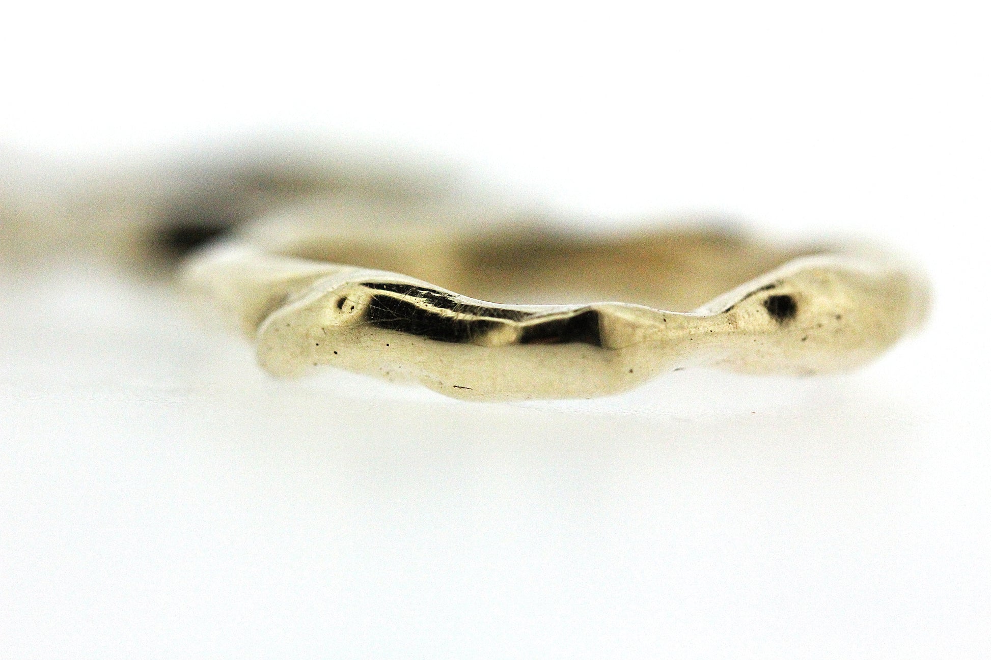 Close up view of gold Surge Band.