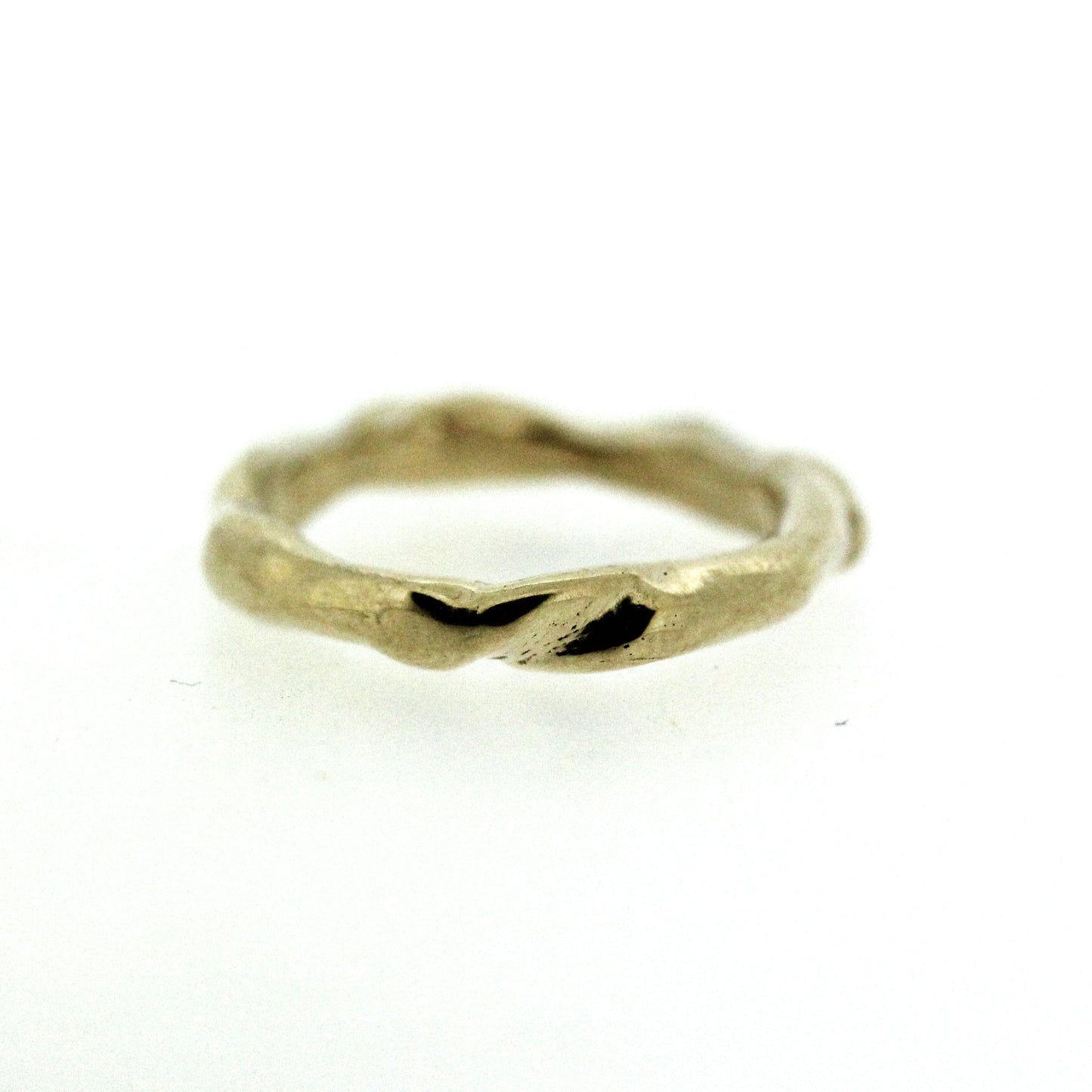 Full view of gold Surge Band. This band has twists and turns throughout.