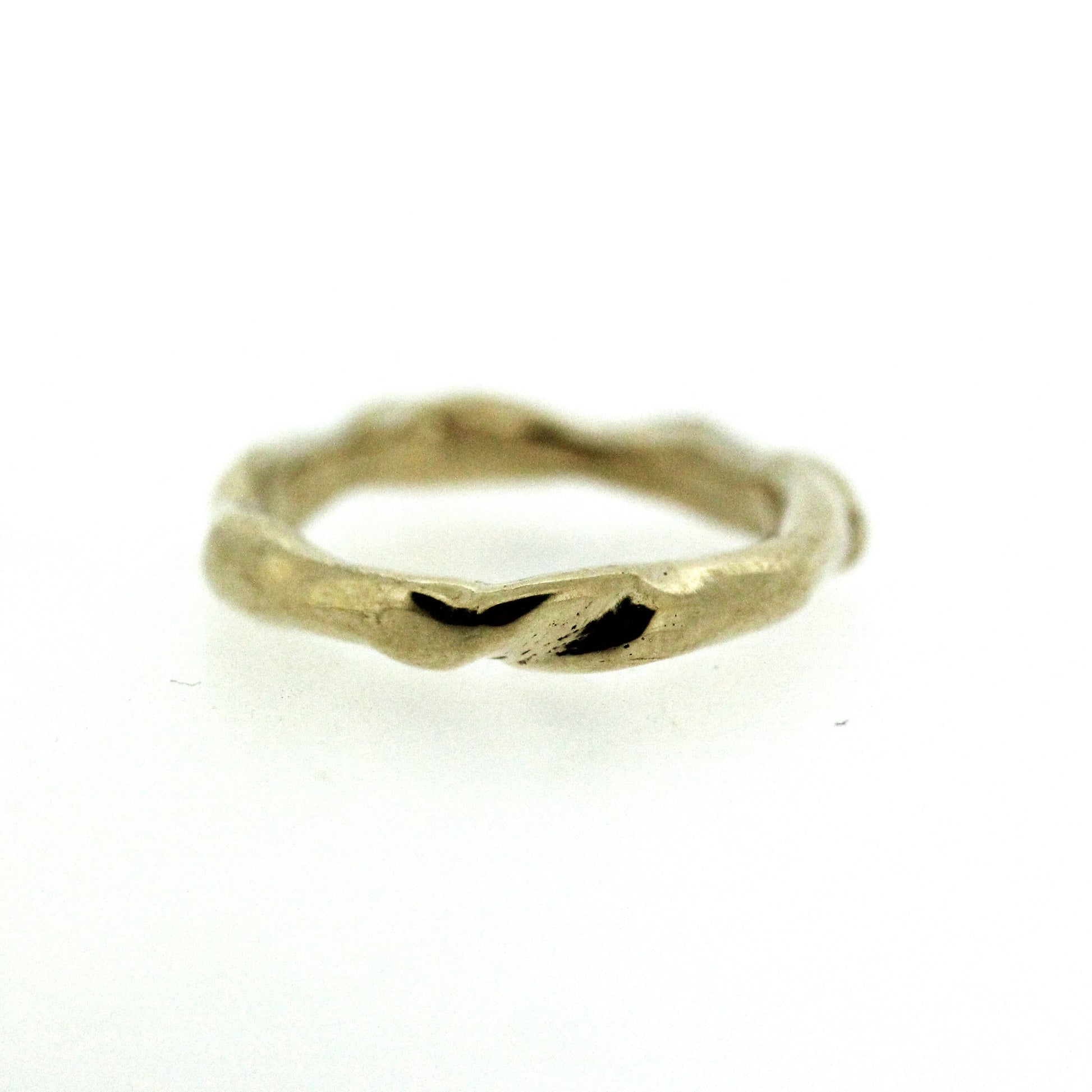 Full view of gold Surge Band. This band has twists and turns throughout.