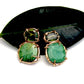 Emerald and peridot stud earrings in gold that have a refined organic quality.