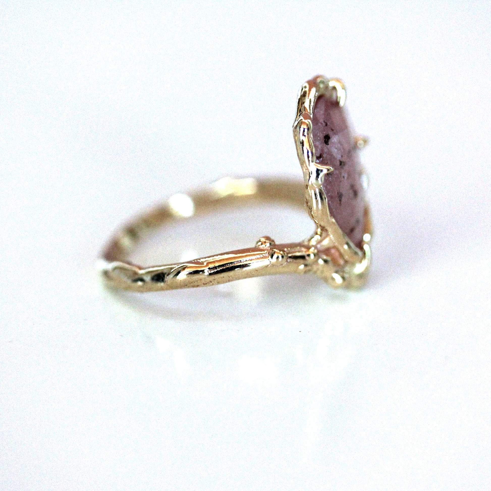 organic pear shaped handmade artist engagement ring with salt and pepper pink rose cut sapphire in asymmetrical perched design