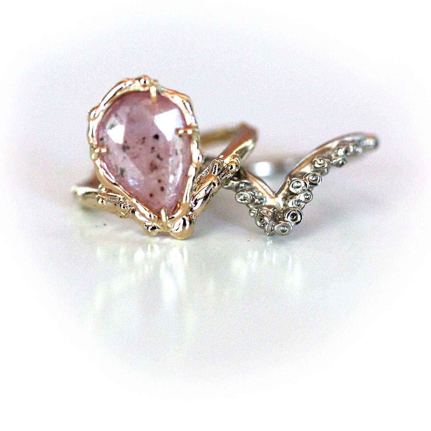 Pale pink sapphire engagement ring and ocean inspired, nautical or coral reef inspired band