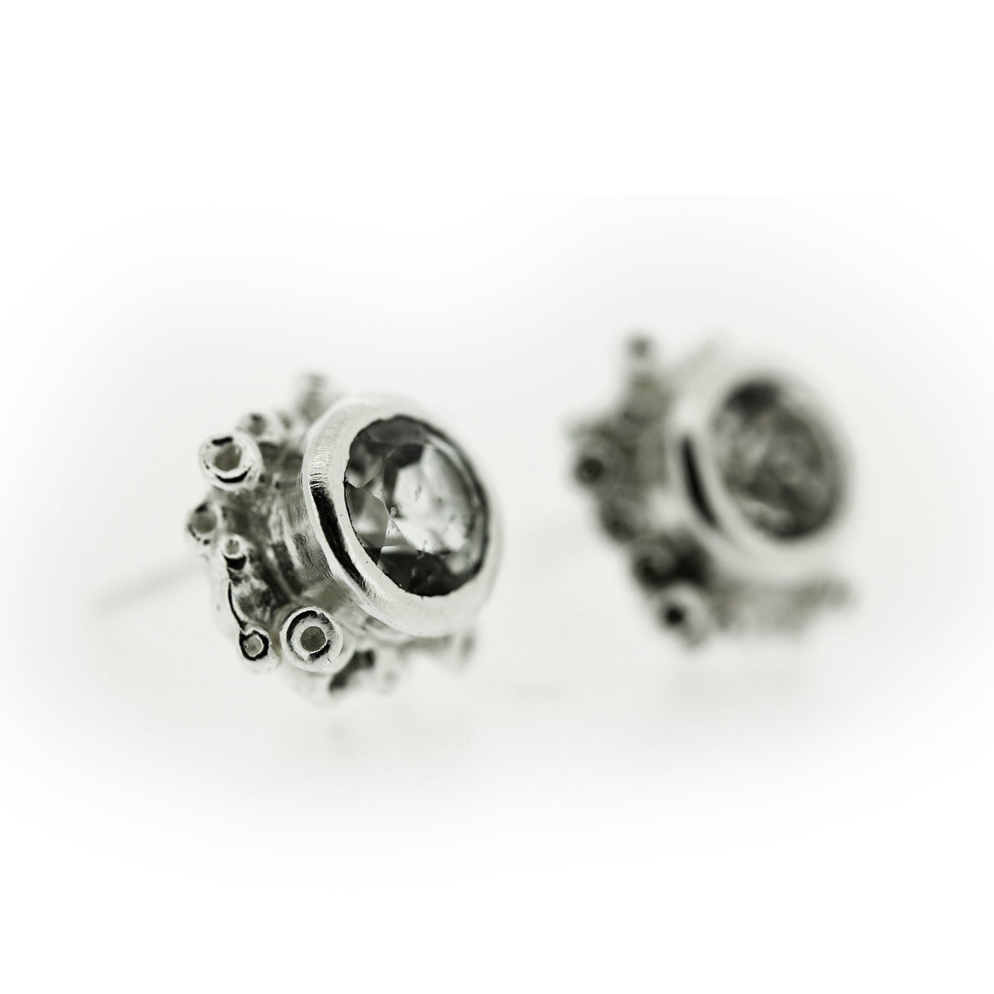 Angled view of Talia Stud Earrings - White Topaz.