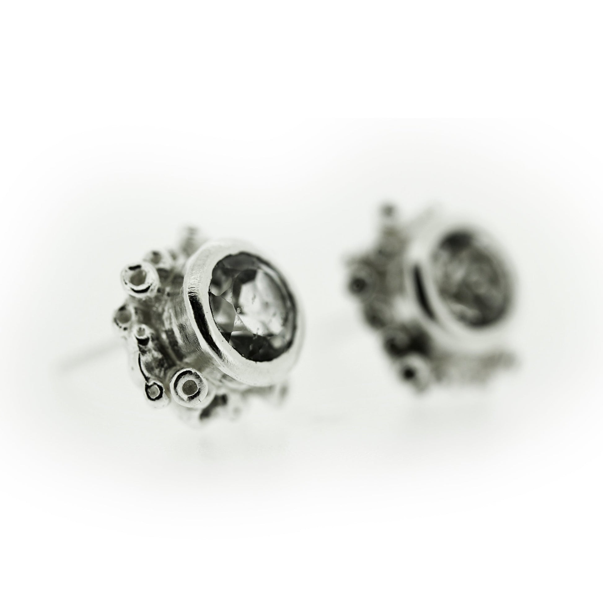 Angled view of Talia Stud Earrings - White Topaz.