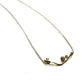 Yellow gold V-style necklace with three small accent diamonds.