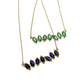 Close up view of green and blue Cherin Necklaces.