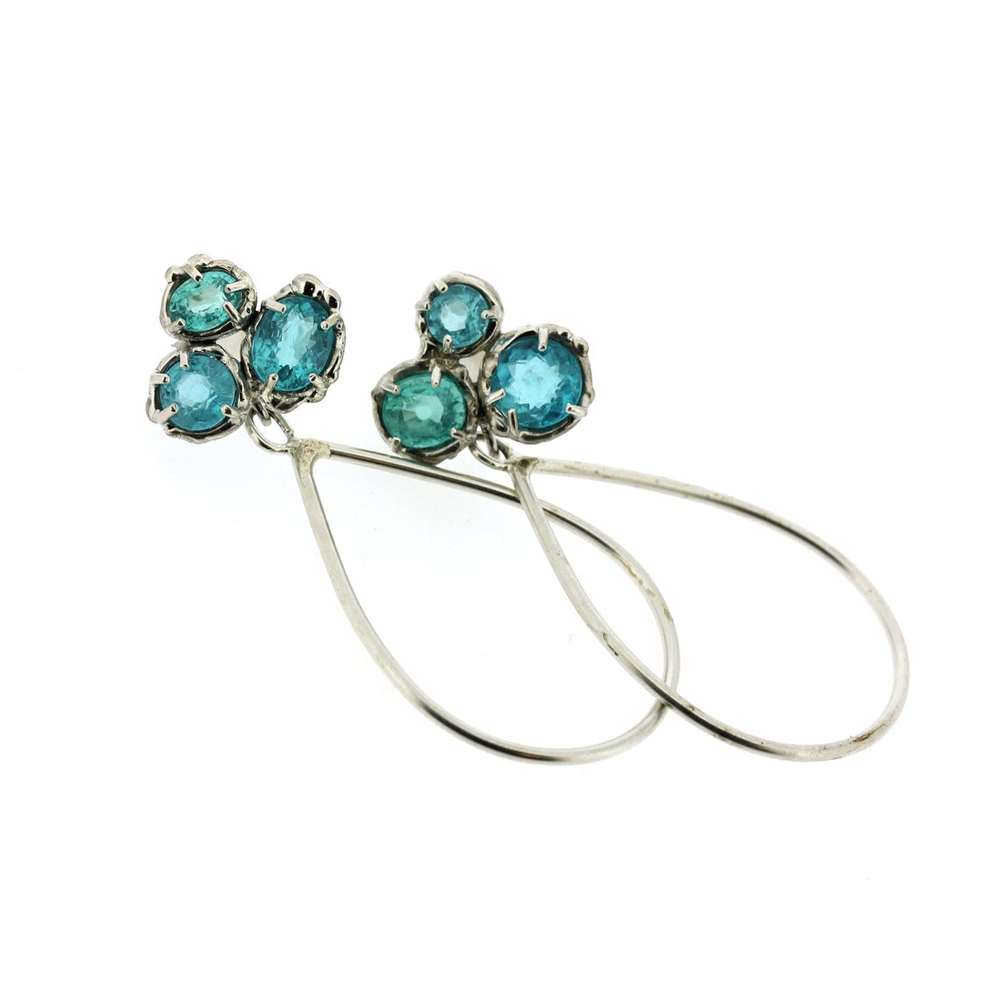 Full view of Elsa Earrings. These earrings showcase a cluster of Apatite as its stud and dangling from that is a teardrop made of silver wire.