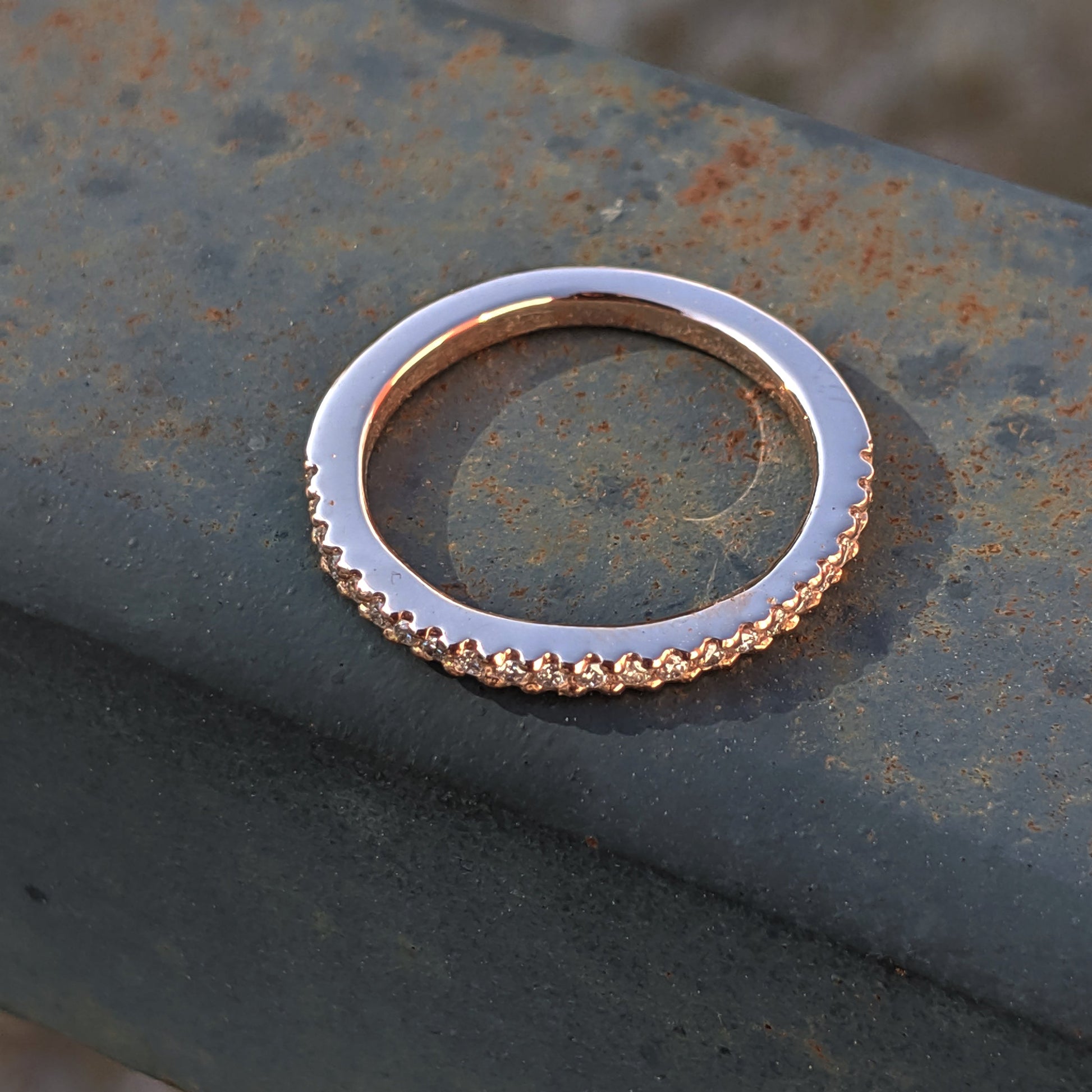 top view handmade micropave wedding band in rose gold and ethical lab grown diamonds