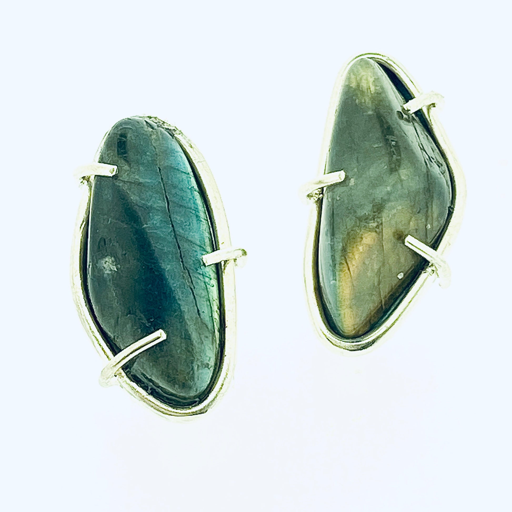 Full view of large Cassius Studs on white background.