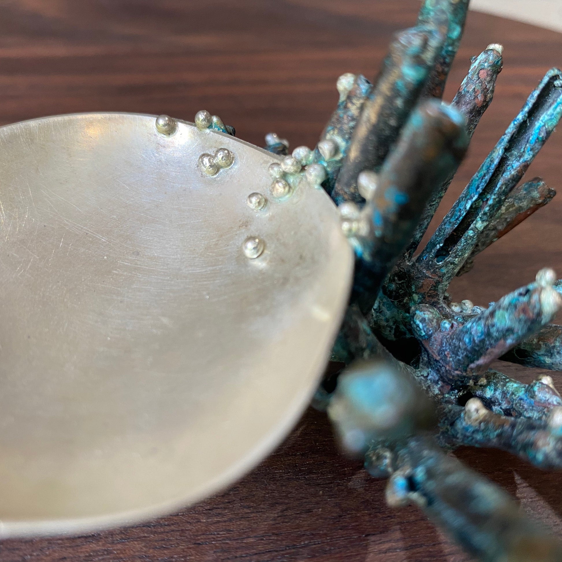 Detail shot of green patinaed Sea Sponge Trinket Dishes.