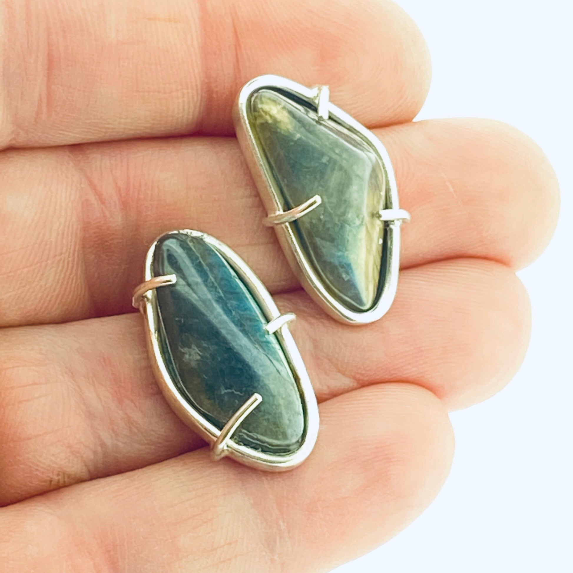 Full view of large Cassius Studs with hand in background to help give an idea of its scale.