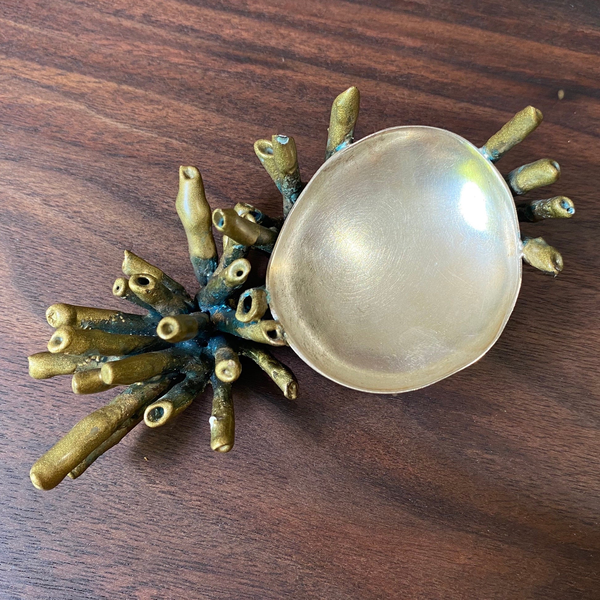 Top view of Sea Sponge Trinket Dishes. This one is powdercoated in gold with a green patina making the coral and the dish is silver.