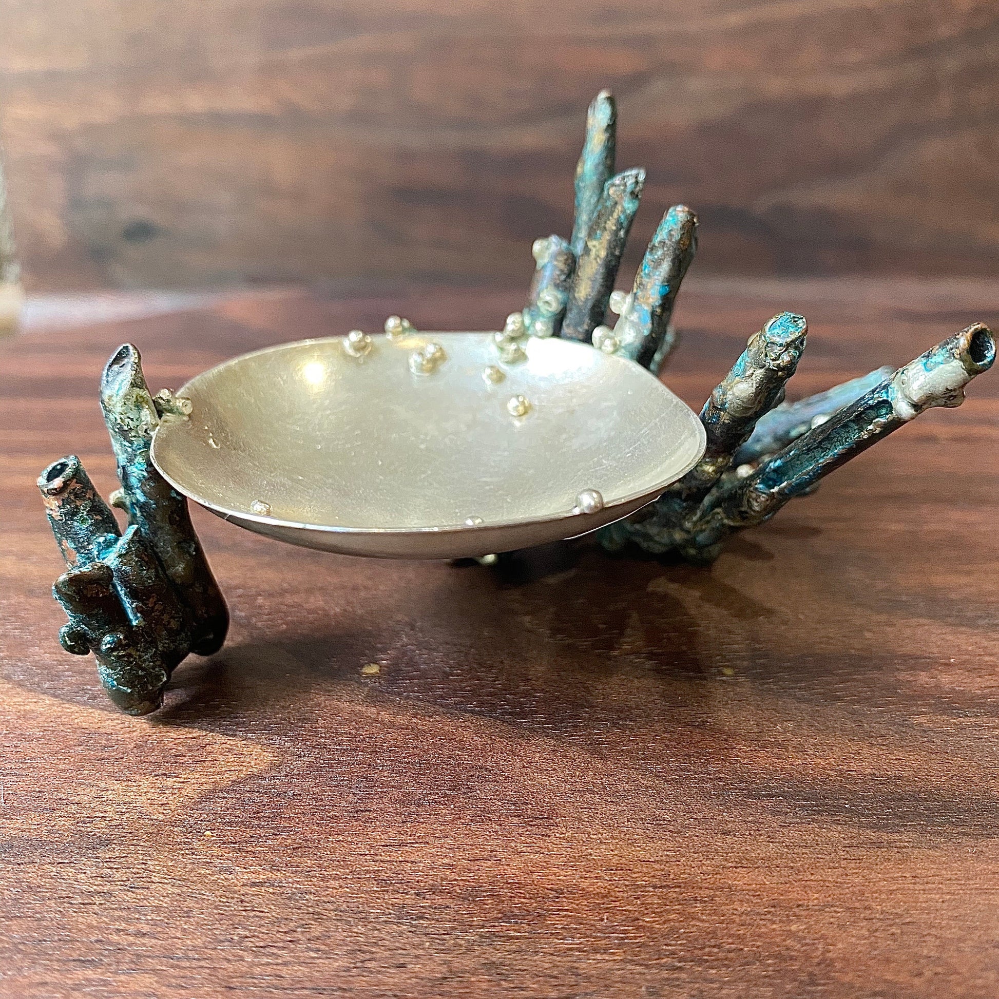 Side view of green patinaed Sea Sponge Trinket Dishes.
