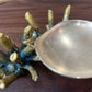 Detail shot of gold and green patinaed Sea Sponge Trinket Dishes.