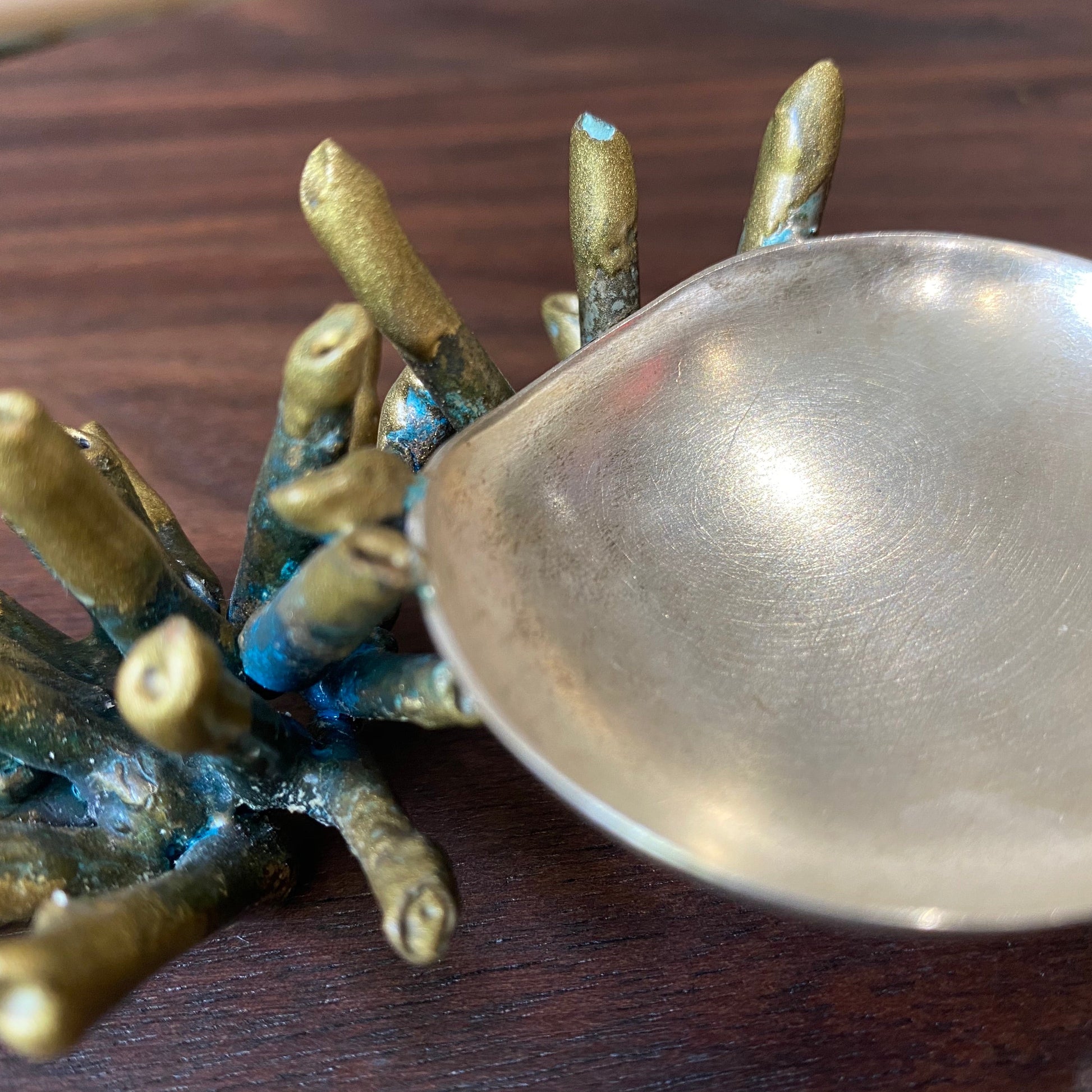 Detail shot of gold and green patinaed Sea Sponge Trinket Dishes.