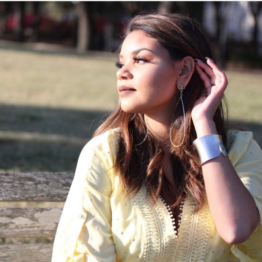 Full view of Citrine Cluster Long Earrings on woman's ear.