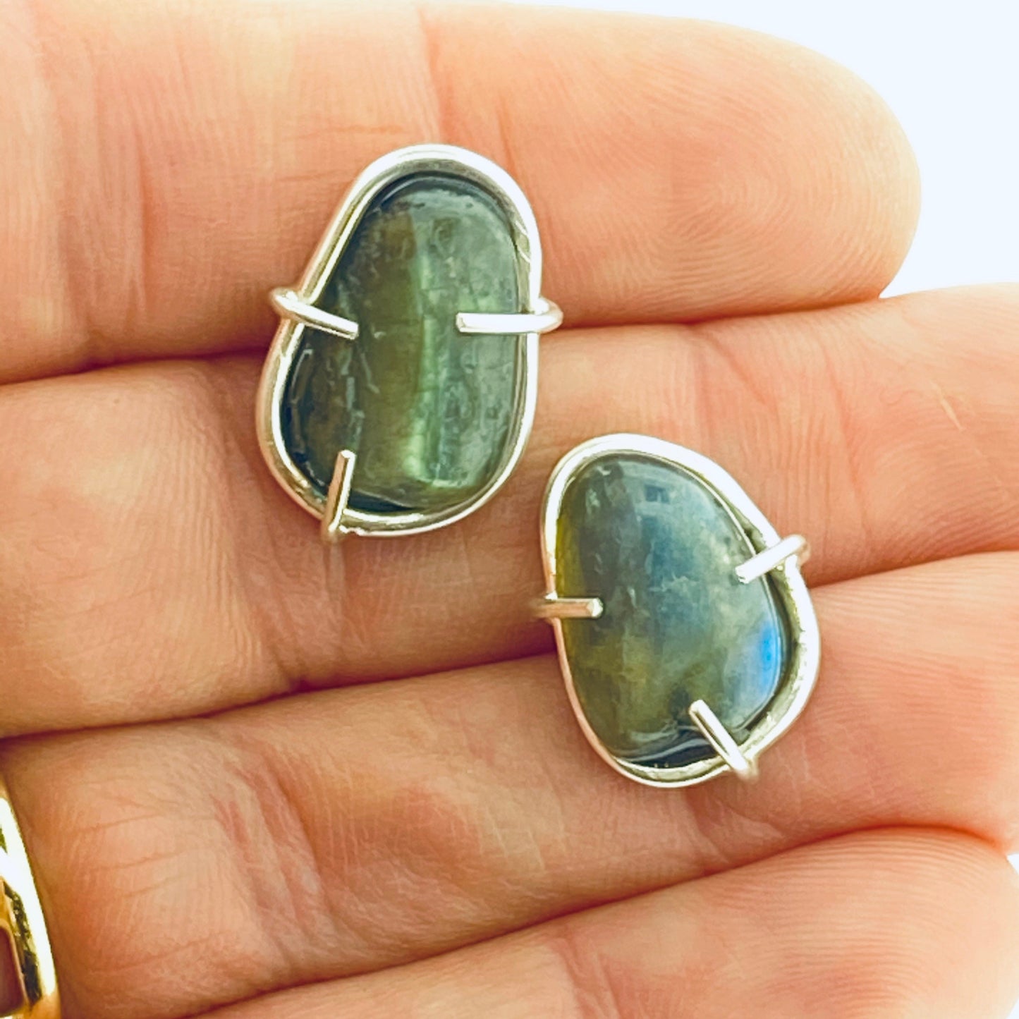 Full view of small Cassius Studs with hand in background to help give an idea of its scale.