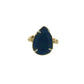 Full view of Lapis 14K Ring. This ring has a set blue lapis in the shape of a teardrop, set with four silver prongs and lays on a gold organic band.