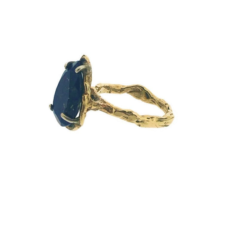 Side view of Lapis 14K Ring on white background.