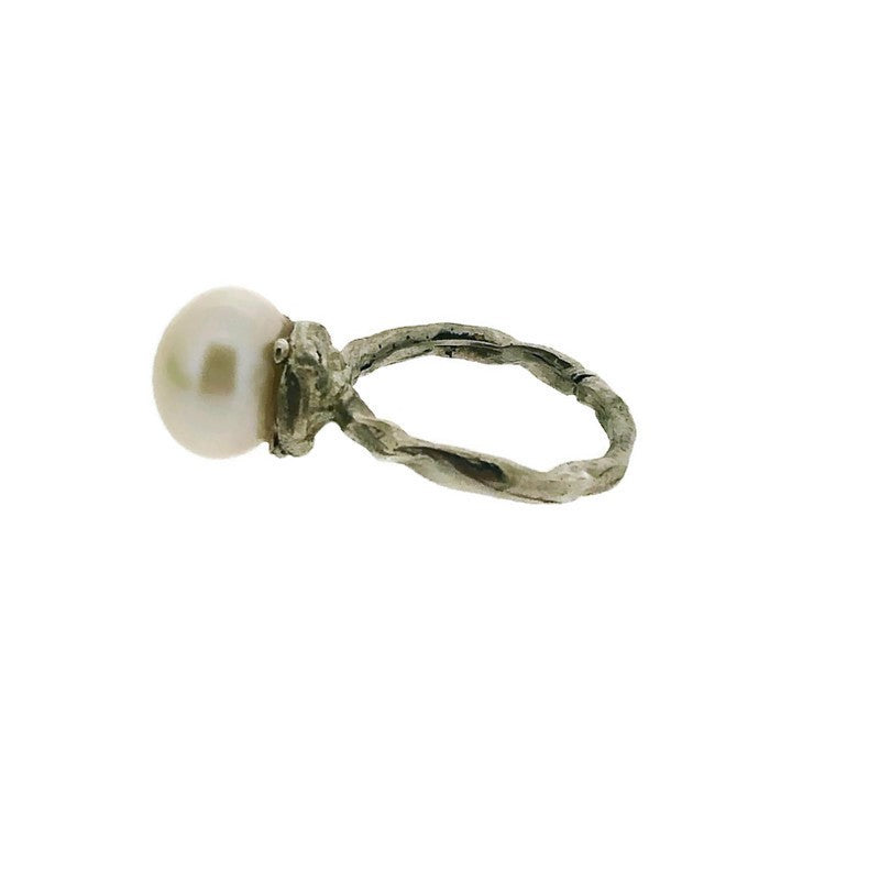 Side view of Organic Pearl Ring laying on its side.