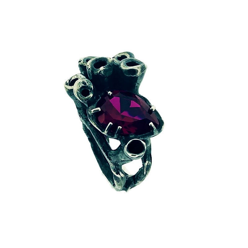 Side angled view of Ruby Seasponge Statement Ring on white background.