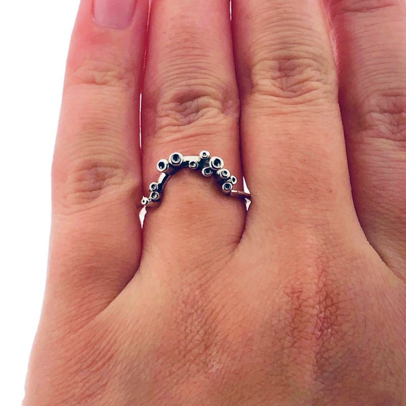 Full view of Sea Sponge Small Curve Ring on woman's hand to help give an idea of its scale.