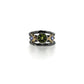 Full view of Solis Ring. Her center stone is a bright, sparkly Peridot that is an intense shade of lime green.  Surrounding her are a pair of brilliant purple princess cut Tanzanites in 14K Yellow gold bezels.  She's capped by two Sterling Silver Bands with just enough black patina in the recessed areas.  