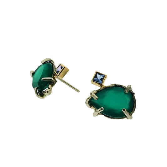 Full view of front and side profile of Green Onyx and Tanzanite Earrings. These stud earrings showcase a teardrop shaped green onyx set with four silver prongs laying on its side. Attached to the top left of the green onyx is a square tanzanite set in gold.