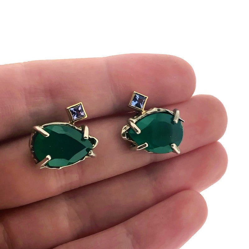 Full view of Green Onyx and Tanzanite Earrings with hand in background to help give an idea of its scale.